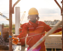 Black construction worker working on a construction site.